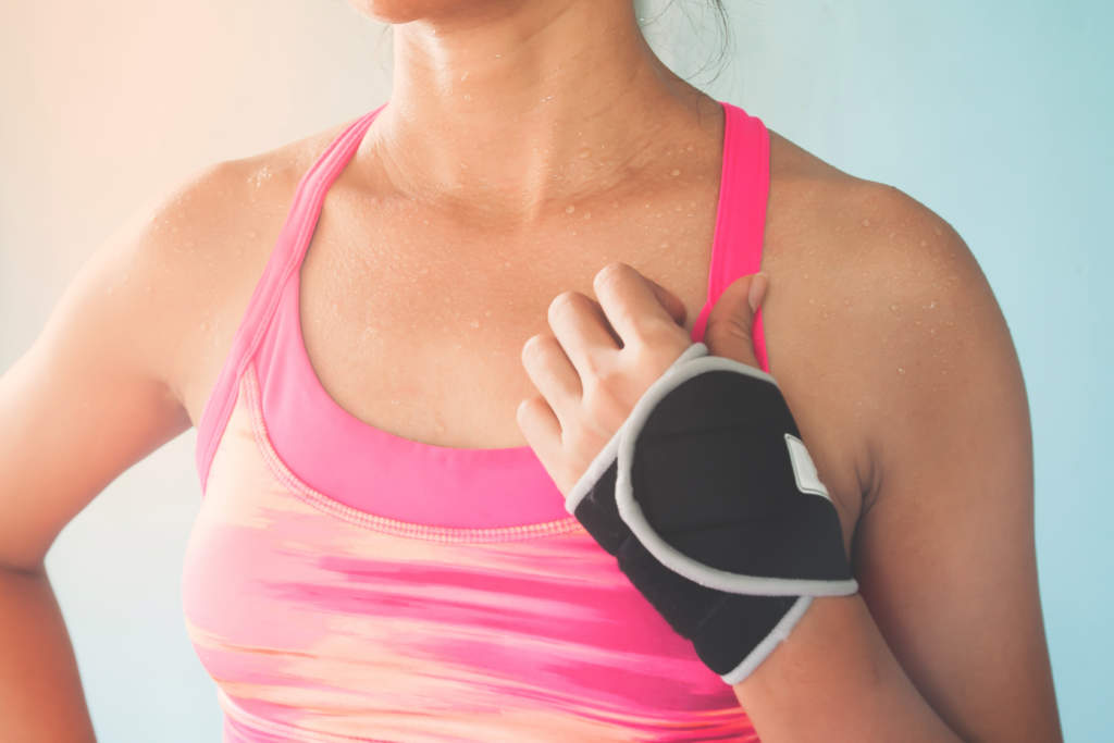 Close up sporty woman in pink color sport bra, Breast cancer, Healthy lifestyle