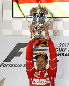 Formula One - F1 - Bahrain Grand Prix - Sakhir, Bahrain - 16/04/17 - First place Ferrari Formula One driver Sebastian Vettel of Germany hold the trophy after winning Bahrain Grand Prix. REUTERS/Hamad I Mohammed