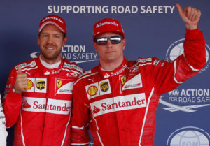 Formula One - F1 - Russian Grand Prix - Sochi, Russia - 29/04/17 - Ferrari Formula One drivers Sebastian Vettel of Germany and Kimi Raikkonen of Finland wave after qualifying session. REUTERS/Maxim Shemetov