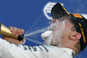 Mercedes' Finnish driver Valtteri Bottas celebrates on the podium after winning the Formula One Russian Grand Prix at the Sochi Autodrom circuit in Sochi on April 30, 2017. / AFP PHOTO / Andrej ISAKOVIC