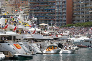 Spectators watch the Formula One Grand Prix from the stands, from balconies and from speedboats at the Monaco racetrack, in Monaco, Sunday, May 24, 2015. (AP Photo/Claude Paris)