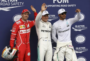 Ferrari driver Sebastian Vettel of Germany and Mercedes drivers Valtteri Bottas of Finland and Lewis Hamilton of Britain, from left to right, wave to fans at the end of the qualifying session for the Austrian Formula One Grand Prix at the Red Bull Ring in Spielberg, Austria, Saturday, July 8, 2017. Bottas clocked the fastest time, Vettel was second and Hamilton third. The Austrian Grand Prix will be held on Sunday. (AP Photo/Ronald Zak)