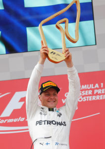 Formula One - F1 - Austrian Grand Prix 2017 - Red Bull Ring, Spielberg, Austria - July 9, 2017 Mercedes' Valtteri Bottas celebrates his win on the podium Reuters/Dominic Ebenbichler