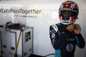 Renault e.dams driver Pierre Gasly gears up ahead of a qualifying run ahead of the Formula E all-electric auto race, Saturday, July 15, 2017, in the Brooklyn borough of New York. This weekend, a Brooklyn waterfront with a view of the Statue of Liberty will be transformed into a racetrack for the Formula E Championship series. (AP Photo/Michael Noble Jr.)