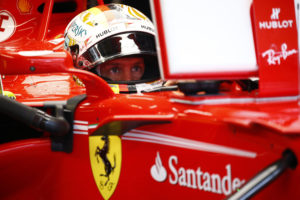 Ferrari driver Sebastian Vettel of Germany sitting in his car prepares for the third practice session at the Sepang International Circuit for the Malaysian Formula One Grand Prix in Sepang, Malaysia, Saturday, Sept. 30, 2017. (AP Photo/Eric To)