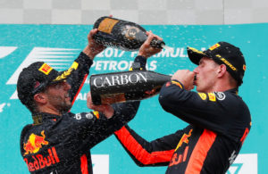 Formula One F1 - Malaysia Grand Prix - Sepang, Malaysia - October 1, 2017. Redbull's Max Verstappen celebrates winning the race with teammate Daniel Ricciardo. REUTERS/Edgar Su