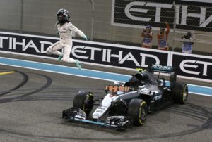 In this picture taken on Sunday, Nov. 27, 2016, Mercedes driver Nico Rosberg of Germany celebrates after finishing second to win the 2016 world championship during the Emirates Formula One Grand Prix at the Yas Marina racetrack in Abu Dhabi, United Arab Emirates. Rosberg's announcement on Friday, Dec. 2, 2016 that he was retiring at the age of 31, five days after earning his first Formula One world championship, shocked the world of motor racing. (AP Photo/Luca Bruno)