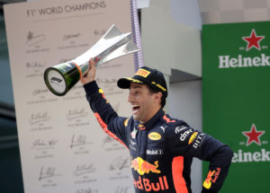 Red Bull driver Daniel Ricciardo of Australia celebrates with his trophy after winning the Chinese Formula One Grand Prix at the Shanghai International Circuit in Shanghai, Sunday, April 15, 2018. (AP Photo/Andy Wong)