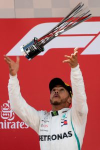 Mercedes' British driver and first place winner Lewis Hamilton celebrates on the podium after the Spanish Formula One Grand Prix at the Circuit de Catalunya in Montmelo in the outskirts of Barcelona on May 13, 2018. / AFP PHOTO / LLUIS GENE