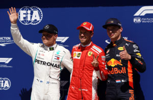 Formula One F1 - Canadian Grand Prix - Circuit Gilles Villeneuve, Montreal, Canada - June 9, 2018 Ferraris Sebastian Vettel (C) celebrates qualifying in pole position with Mercedes Valtteri Bottas (L) in second and Red Bulls Max Verstappen in third REUTERS/Carlo Allegri