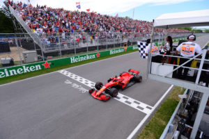 Formula One F1 - Canadian Grand Prix - Circuit Gilles Villeneuve, Montreal, Canada - June 10, 2018 Ferrari's Sebastian Vettel passes the chequered flag to win the race Paul Chiasson/Pool via REUTERS