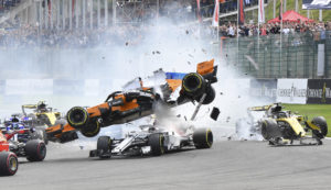 The car of Mclaren driver Fernando Alonso of Spain, center top, is involved in a crash along with Sauber driver Charles Leclerc of Monaco. center bottom, during the Belgian Formula One Grand Prix in Spa-Francorchamps, Belgium, Sunday, Aug. 26, 2018. (AP Photo/Geert Vanden Wijngaert)