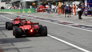 Ferrari driver Sebastian Vettel of Germany steers his car followed by Ferrari driver Kimi Raikkonen of Finland during the qualifying session at the Monza racetrack, in Monza, Italy, Saturday, Sept. 1, 2018. The Formula One race will be held on Sunday. (AP Photo/Luca Bruno, Pool)