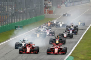 Ferrari drivers Kimi Raikkonen of Finland and Sebastian Vettel of Germany lead at the start of the race during the Formula One Italy Grand Prix at the Monza racetrack, in Monza, Italy, Sunday, Sept. 2, 2018. (AP Photo/Antonio Calanni)