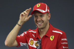 Ferrari driver Sebastian Vettel of Germany reacts as he attends a press conference at the Suzuka Circuit ahead of the Japanese Formula One Grand Prix in Suzuka, central Japan, Thursday, Oct. 4, 2018. (AP Photo/Ng Han Guan)