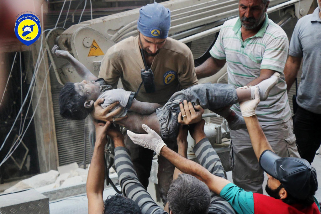 ap foto : uncredited : file -- in this tuesday, sept. 27, 2016, file photo, provided by the syrian civil defense group known as the white helmets, shows a civil defense worker carrying the body of a child after airstrikes hit al-shaar neighborhood in aleppo, syria. nearly 100 children were killed in a single week in aleppo as syrian and russian warplanes sought to bombard into submission the rebel eastern districts of the city that have held out against syrian government forces for five years. without hope for the future, no regular schooling and little access to nutritious food, the children of aleppo and their parents struggle to survive and fear the threat an imminent ground offensive. (syrian civil defense white helmets via ap, file) ap provides access to this file image posted on tuesday sept. 27, 2016 by the syrian civil defense group known as the white helmets which has been verified and is consistent with other ap reporting. logo must remain intac mideast syria children of alepp automatarkiverad