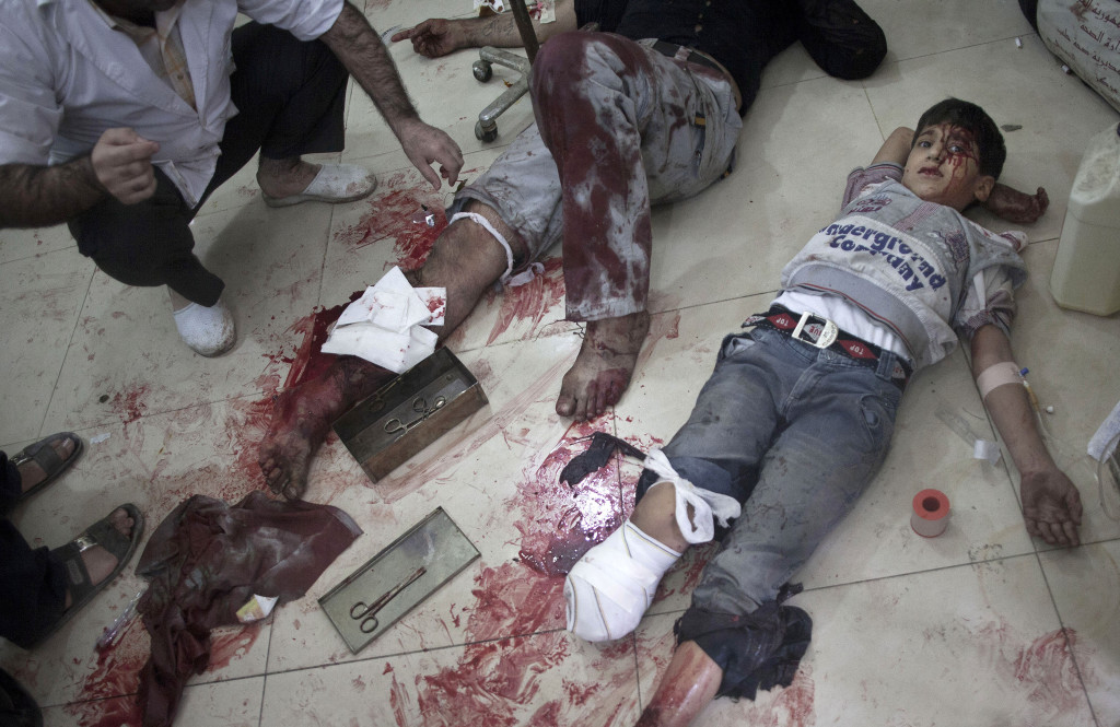 ap foto : manu brabo : note graphic content - file - in this thursday, oct. 11, 2012 file photo, doctors and volunteers treat a syrian boy wounded by syrian army shelling at dar al-shifaa hospital in aleppo, syria. when syriaís arab spring uprising began in early 2011, mohammed al-haj quickly joined in the protests against president bashar assad, hoping for democratic rule. but within a year, the uprising slid into outright civil war. mohammedís home city of aleppo became one of the worst battlefields as government forces besieged rebel-held neighborhoods. in late 2012, mohammed worked as a volunteer at this front-line hospital. (ap photo/manu brabo, file) part of a package of 14 photos; thursday, oct. 11, 2012 file phot migrants mohammeds journey photo galler automatarkiverad
