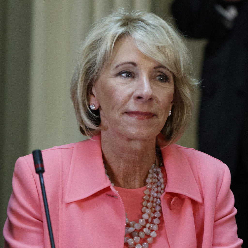 Education Secretary Betsy DeVos listens during a meeting between President Donald Trump and business leaders in the State Department Library of the Eisenhower Executive Office Building on the White House complex in Washington, Tuesday, April 11, 2017. (AP Photo/Evan Vucci)