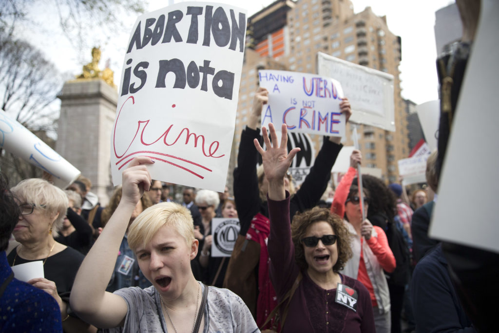 ap foto : mary altaffer : kayla forshey, left, participates in a rally to condemn republican presidential candidate donald trump's remarks about women and abortion thursday, march 31, 2016, in new york. (ap photo/mary altaffer) gop 2016 trump abortio automatarkiverad